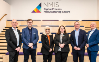 Attendees standing for official photo at opening of digital processing manufacturing centre