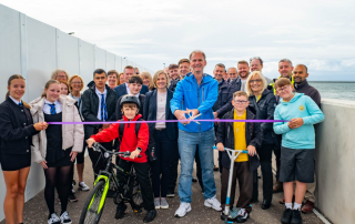 Group of people on caostal path