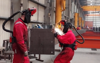 Two people welding