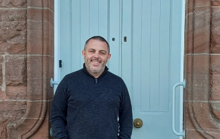 Man standing in front of door