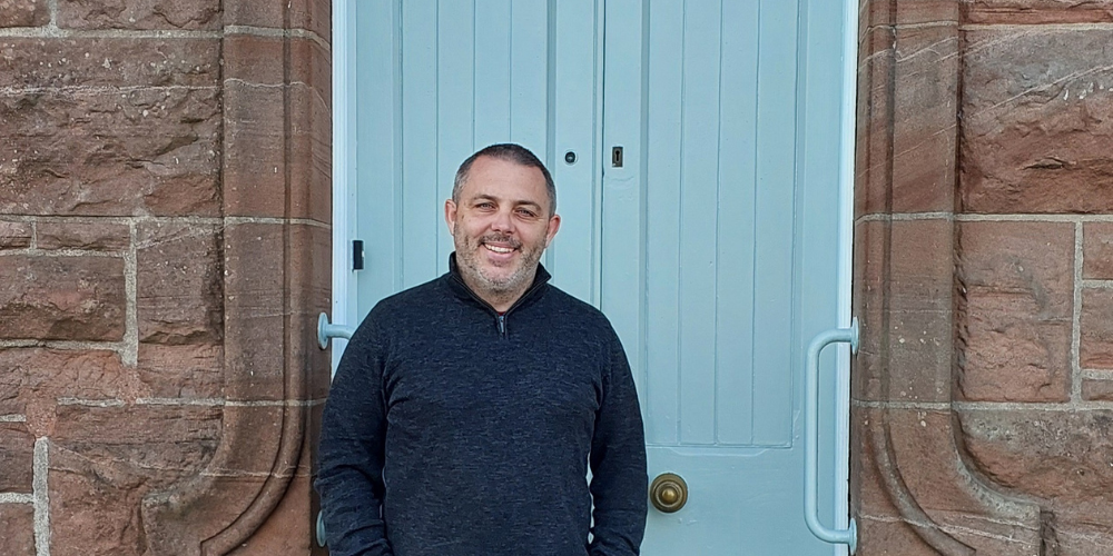 Man standing in front of door