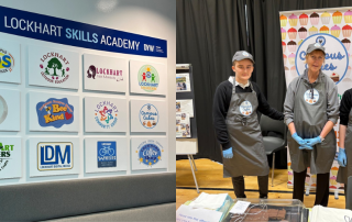 Board with logos and three people with branded aprons