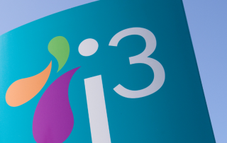 Signage which reads i3 against blue sky